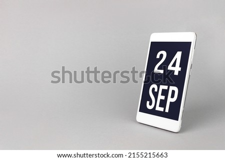 September 24th. Day 24 of month, Calendar date. Smartphone with calendar day, calendar display on your smartphone.  Autumn month, day of the year concept