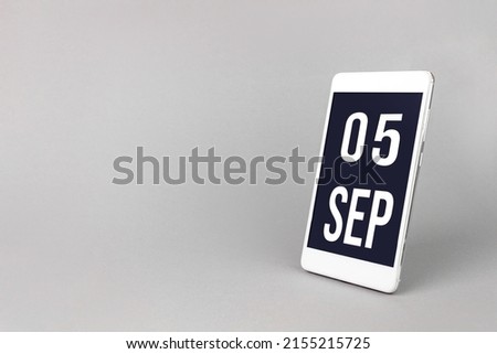 September 5th. Day 5 of month, Calendar date. Smartphone with calendar day, calendar display on your smartphone.  Autumn month, day of the year concept
