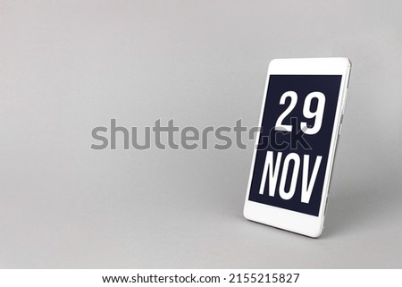 November 29th. Day 29 of month, Calendar date. Smartphone with calendar day, calendar display on your smartphone.  Autumn month, day of the year concept
