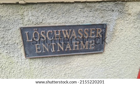 Metal sign with inscription in German - fire water extraction point