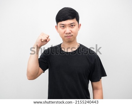 Asian man show fist up confident face white background