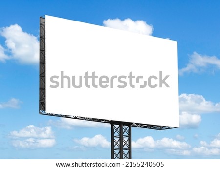 Out door billboard on blue sky background with clipping path