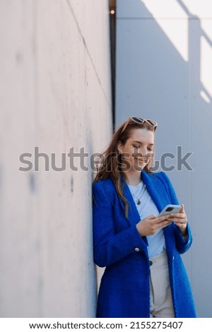 Woman using internet banking mobile app. Isolated background. Vertical photo