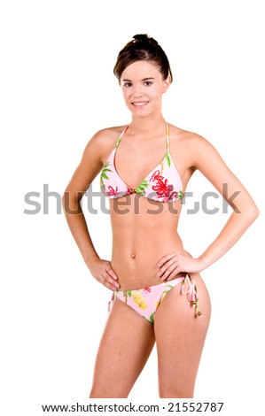 Three quarter body view of a brunette bikini girl isolated on white wearing a swim suit