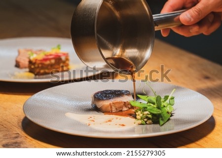 Dishes are prepared in a Michelin-starred restaurant Royalty-Free Stock Photo #2155279305
