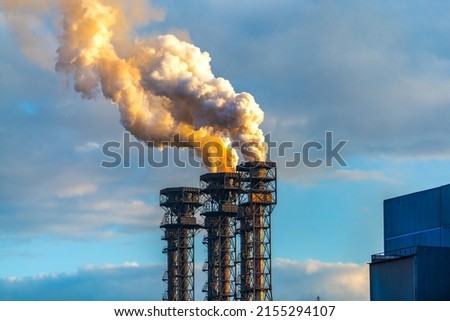 Burning gas torch with thick poisonous smoke. Gas processing and oil refinery. Air pollution! Exhaust gases, ozone depletion, greenhouse effect.  Royalty-Free Stock Photo #2155294107