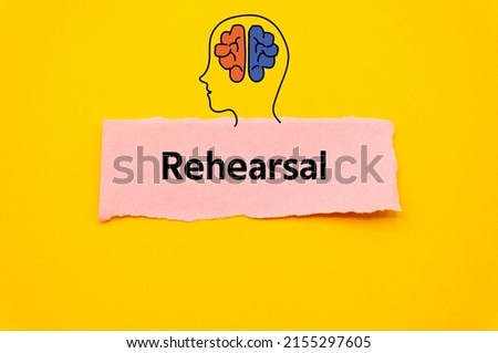Rehearsal.The word is written on a slip of colored paper. Psychological terms, psychologic words, Spiritual terminology. psychiatric research. Mental Health Buzzwords.