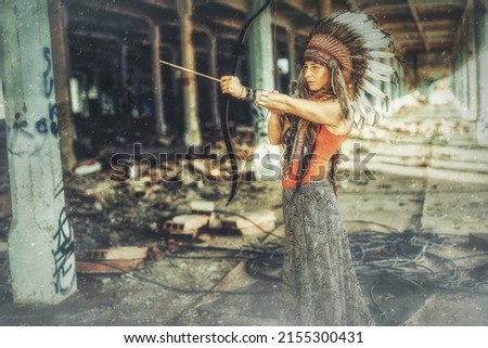 beautiful shamanic girl in the vintage industry building. Old photo effect.