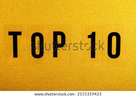 image of top 10 text gold background 