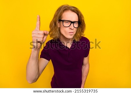 Photo of sad young red hairdo guy index wear eyewear purple polo isolated on yellow color background