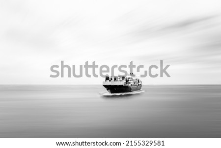 black and white Container ship sailing in deep sea for transporting cargo logistic import and export goods internationally around the world, including Asia Pacific and Europe, business and industry