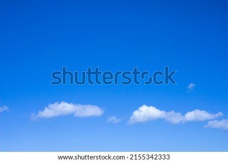 White clouds on a blue summer sky with copy space. Free space for text or advertising.