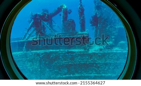 Aruba -2022: View from viewing portals on Atlantis VI Submarine. Canadian passenger submarine company. Interior of the tourist submarine Atlantis whilst submerged. Sunken ship makes coral reef. Royalty-Free Stock Photo #2155364627