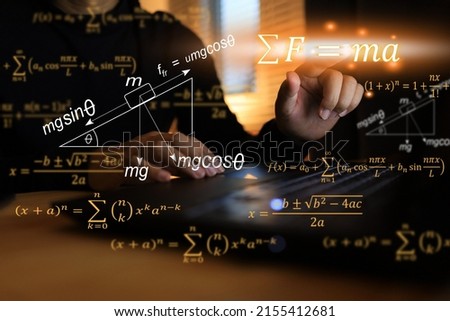The Man in Black is clicking, press touch to activate. Newton's second law of motion F equal to ma consisting of zeta angle, mass, friction, acceleration, gravity, and axial force. Royalty-Free Stock Photo #2155412681