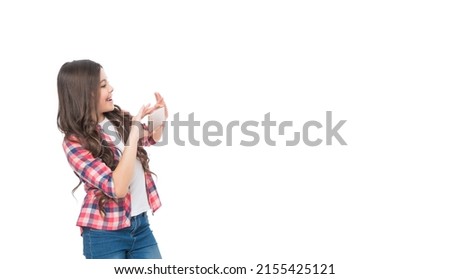 glad teen child taking picture on phone camera isolated on white background with copy space