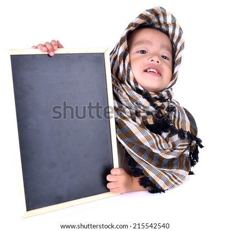 Cute two year old muslim girl holding a small chalkboard. Isolated on white background.