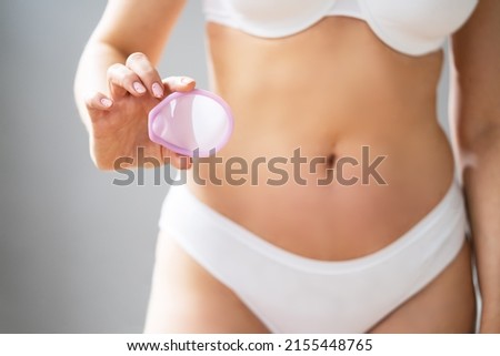 Diaphragm Vaginal Contraceptive Cap. . Spermicide Contraception And Birth Control Royalty-Free Stock Photo #2155448765