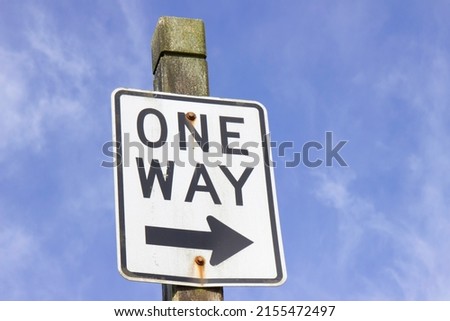 Close up photo of a One Way sign
