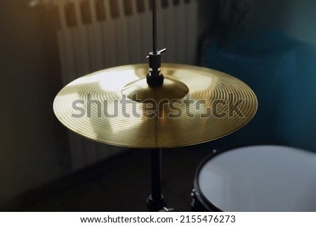 Closeup view of drum cymbal in studio Royalty-Free Stock Photo #2155476273