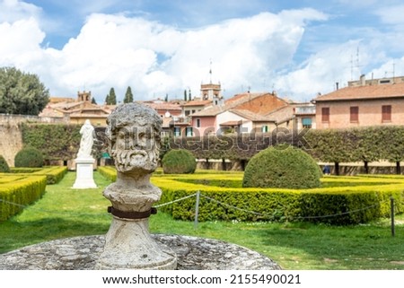 Tuscany San Quirico d'Orcia historical garden with sculptures and statues. Royalty-Free Stock Photo #2155490021