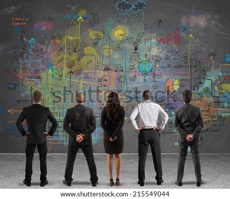 Business team drawing a new complex project Royalty-Free Stock Photo #215549044