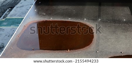
Pooling dirty water on a flat roof.  Excessive flooding can attract insects, fungi, vegetation and cause structural damage to buildings

 Royalty-Free Stock Photo #2155494233