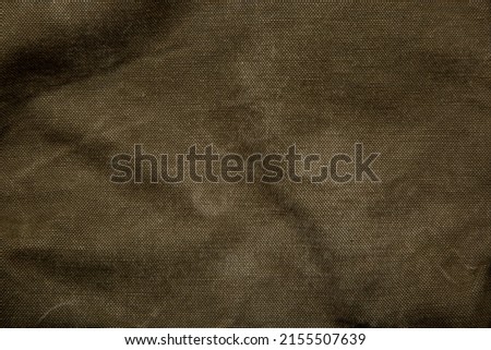 Closeup texture of canvas fabric. Khaki fabric background.