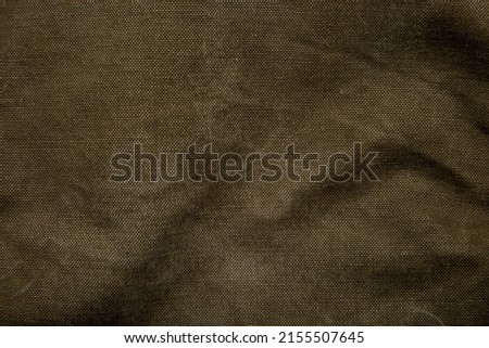 Closeup texture of canvas fabric. Khaki fabric background. Royalty-Free Stock Photo #2155507645