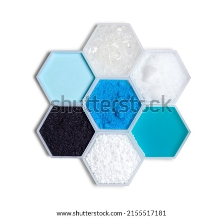 Chemical ingredient in hexagonal molecular shaped container. Sodium Thiosulfate, Sodium Hydroxide Pellets, Shampoo Liquid, Urea, Potassium Permanganate, Hair Conditioner and Copper (II) Sulfate. Royalty-Free Stock Photo #2155517181