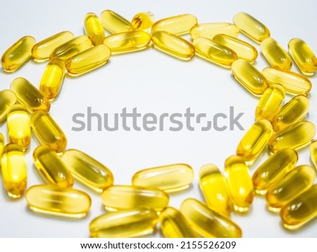 Salmon fish oil softgel forms a circle, the space in the middle is for writing