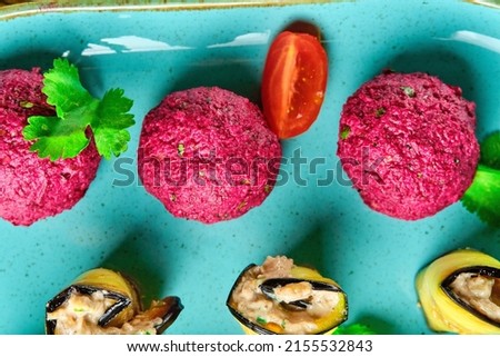 Vegetable balls with eggplant. Georgian cuisine. On a blue plate