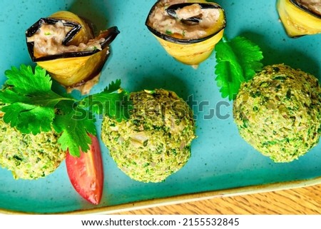 Vegetable balls with eggplant. Georgian cuisine. On a blue plate