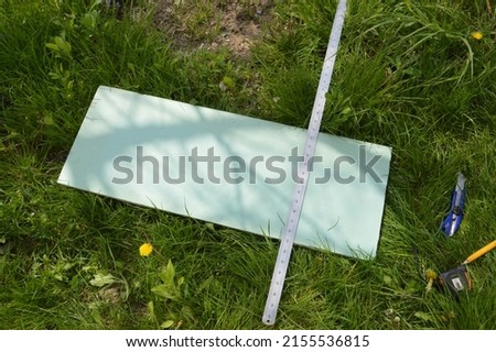 Sign for inscriptions and drawings on a the grass