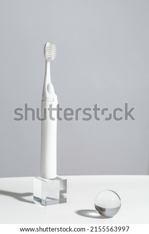 Modern rechargeable sonic or electric toothbrush with copy space
