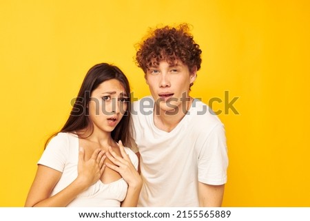 teenagers standing side by side in white t-shirts posing Lifestyle unaltered