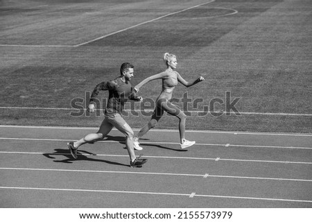 energy stamina. fit sporty people jumping. man and woman sport trainer run. fitness couple training Royalty-Free Stock Photo #2155573979