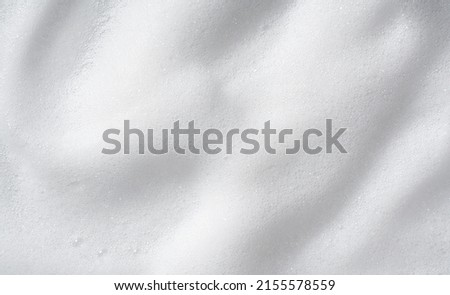Foam bubble from soap or shampoo washing on top view.Skincare cleanser foam texture. Royalty-Free Stock Photo #2155578559