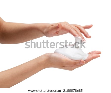 Female hand with soap bubbles on white background. Hands with white bubbles. Texture of white soap foam on female hand. Royalty-Free Stock Photo #2155578685