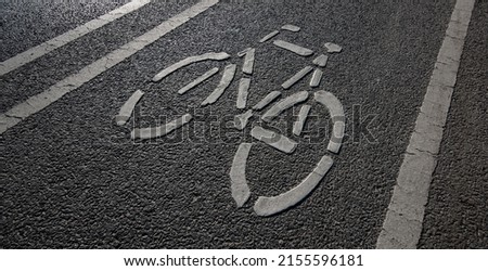 white bicycle sign on bike lane Royalty-Free Stock Photo #2155596181