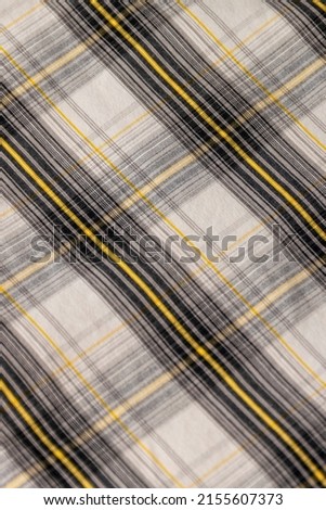 Classic geometric tweed fabric in gray and yellow

