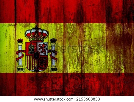 Spanish flag on old wood plank.