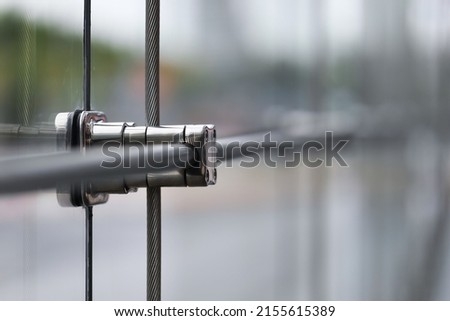 Closeup Stainless fasteners elements of glass curtain walls system. Royalty-Free Stock Photo #2155615389