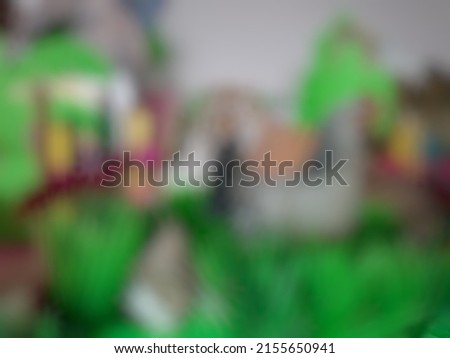 Defocused or blurred abstract background of a colorful miniature of zoo made by student in elementary school