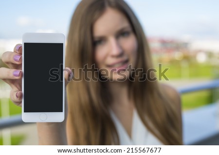 woman holding smartphone in hand Royalty-Free Stock Photo #215567677