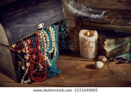 Pirate still life with a treasure chest on wooden table