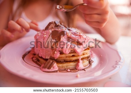 young child girl with a pancake .Horizontal shoot