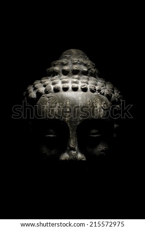 Buddha head on a black background