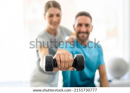 A Modern rehabilitation physiotherapy woman worker with man client