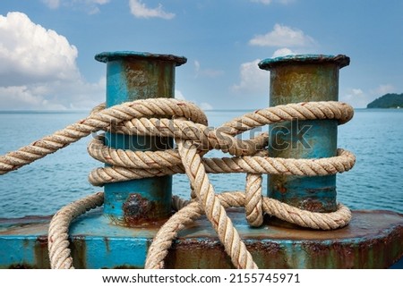 The rope anchored the boat into the harbor. Royalty-Free Stock Photo #2155745971