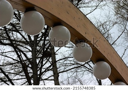 wooden arch with lights in the park